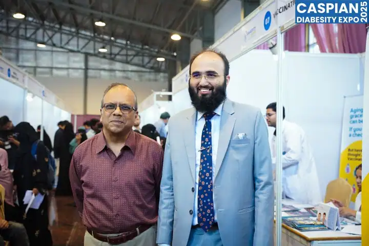 Visitors walking through the exhibition stalls